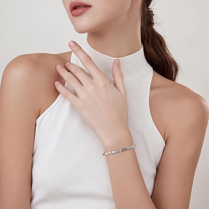 A woman wearing an adjustable boho style agalmatolite bracelet