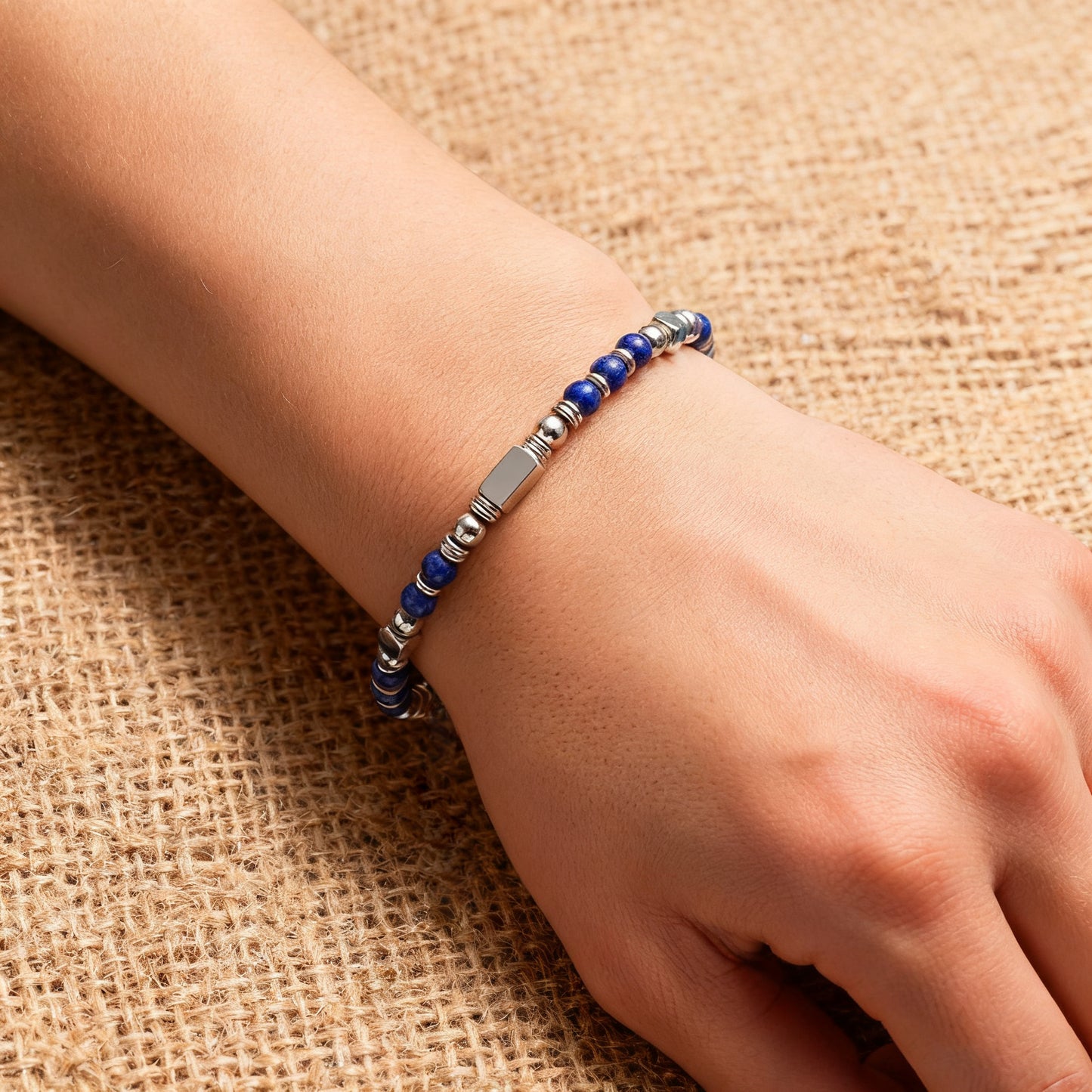 A woman wearing an adjustable boho style Lapis Lazuli energy bracelet.