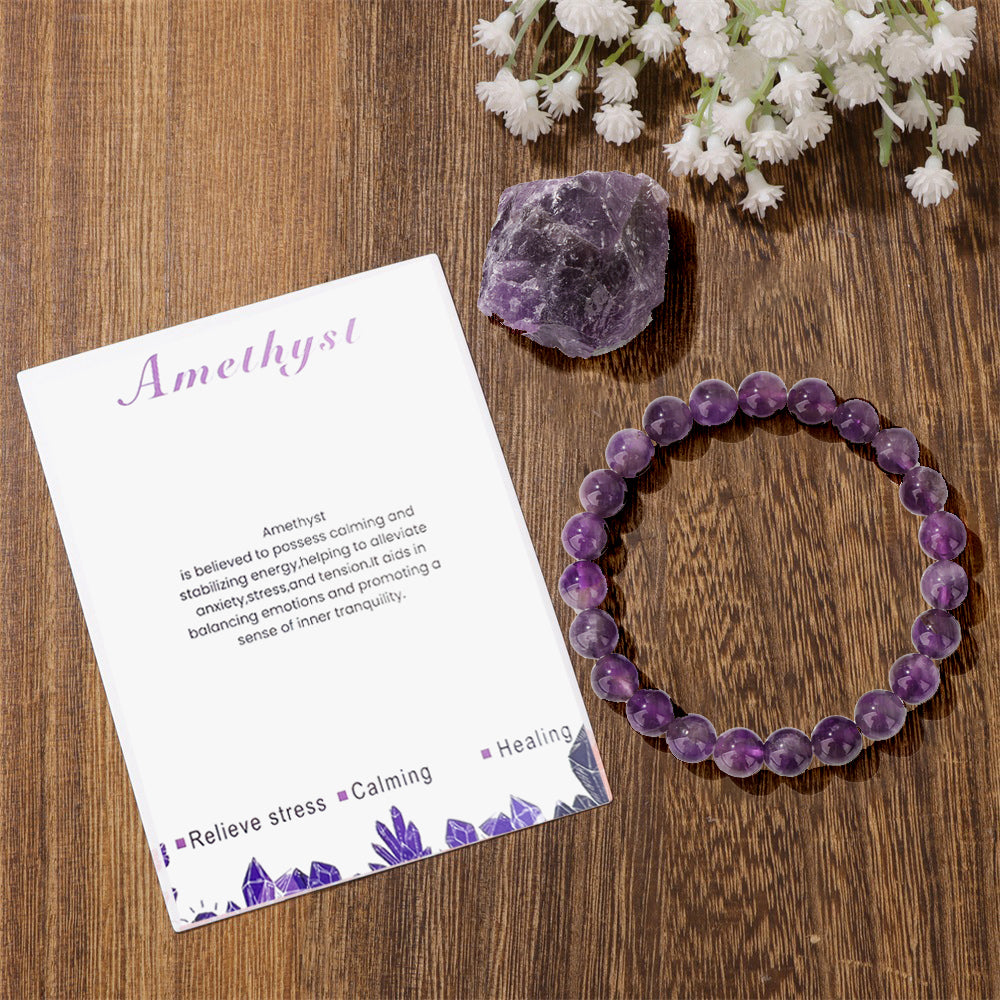 Plan view of a 8mm crystal bead bracelet with natural amethyst texture.